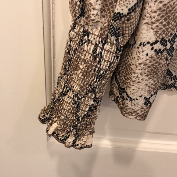 Printed blouse with smocking at wrist and across the front at neckline. - Picture 2 of 4